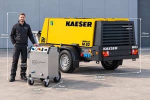 Dry ice blaster next to a larger mobile compressor